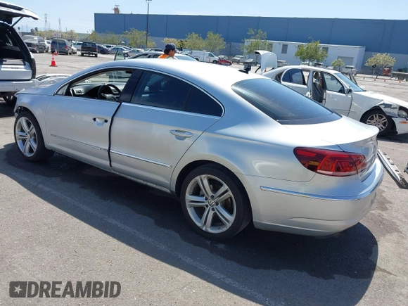 2014 Volkswagen CC R-Line with VIN WVWBP7AN0EE527649, listed as a IAAI auction lot 42009588 with 122,964 mi miles. Bid and sale history available at carsss.com. Image 3.