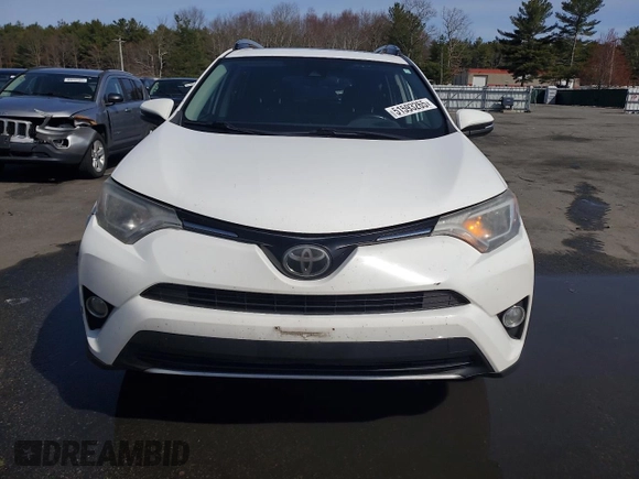 2018 Toyota RAV4 XLE with VIN 2T3WFREV4JW476959, listed as a Copart auction lot 51593265 with 198,596 mi miles and Salvage Title. Bid and sale history available at DreamBid. Image 5.