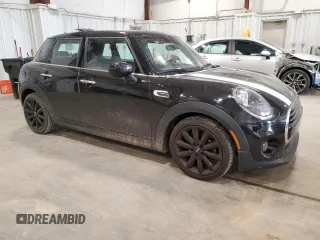 2021 MINI Hardtop 4 Door Oxford Edition with VIN WMWXU7C00M2N49230, listed as a Copart auction lot 77797914 with 51,877 mi miles and Salvage title. Bid and sale history available at DreamBid. Image 4.
