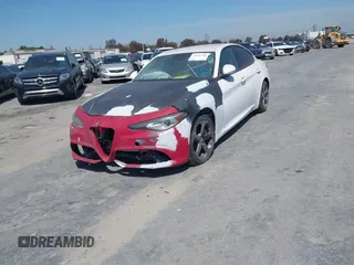 2018 Alfa Romeo Giulia with VIN ZARFAEBNXJ7566002, listed as a IAAI auction lot 41681991 with 23,167 mi miles. Bid and sale history available at carsss.com. Image 2.