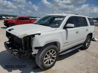 2015 GMC Yukon Denali with VIN 1GKS1CKJ3FR579085, listed as a Copart auction lot 67657084 with 98,456 mi miles and Salvage Title. Bid and sale history available at carsss.com. Image 1.