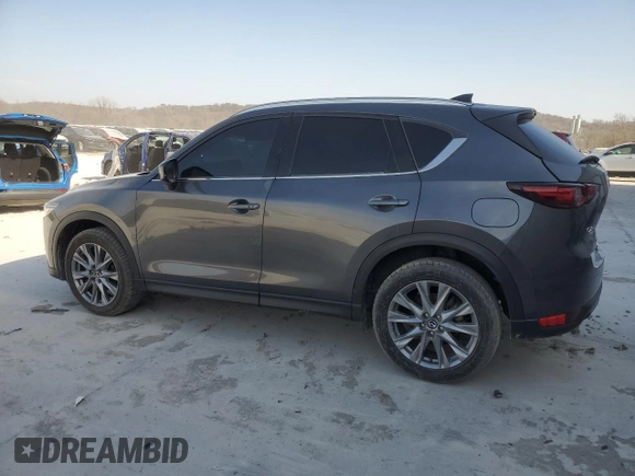 2021 Mazda CX-5 Grand Touring with VIN JM3KFBDM0M1464817, listed as a Copart auction lot 48821965 with 53,648 mi miles and Clean Title. Bid and sale history available at carsss.com. Image 2.