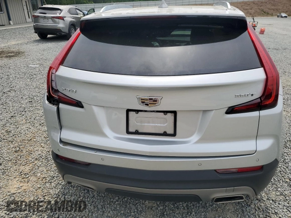 2021 Cadillac XT4 FWD Premium Luxury z VIN 1GYFZCR40MF000293, wystawiony jako Copart lot #58710565 z przebiegiem 49 721 mil mil oraz Szkoda całkowita • Salvage title. Historia ofert i sprzedaży dostępna na DreamBid. Obrazek 6.