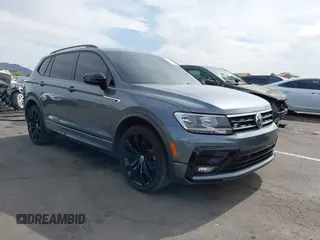 2021 Volkswagen Tiguan SE z VIN 3VV3B7AX1MM020886, wystawiony jako IAAI lot #42343606 z przebiegiem 77 882 mil mil oraz . Historia ofert i sprzedaży dostępna na DreamBid. Obrazek 1.