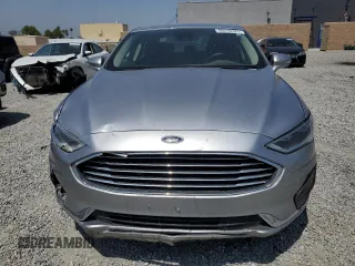 2020 Ford Fusion SEL z VIN 3FA6P0CD3LR196210, wystawiony jako Copart lot #60240925 z przebiegiem 81 768 mil mil oraz Szkoda całkowita • Salvage title. Historia ofert i sprzedaży dostępna na DreamBid. Obrazek 5.