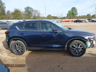 2018 Mazda CX-5 Touring z VIN JM3KFACM0J1389057, wystawiony jako IAAI lot #40922679 z przebiegiem 140 026 mil mil oraz . Historia ofert i sprzedaży dostępna na DreamBid. Obrazek 14.