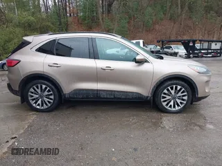 2021 Ford Escape Titanium Hybrid with VIN 1FMCU9DZXMUA66161, listed as a IAAI auction lot 41208651 with 61,198 mi miles and . Bid and sale history available at DreamBid. Image 13.