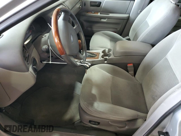 2006 Ford Taurus with VIN 1FAHP56U46A162809, listed as a Copart auction lot 60476125 with 95,542 mi miles and Salvage title. Bid and sale history available at DreamBid. Image 7.