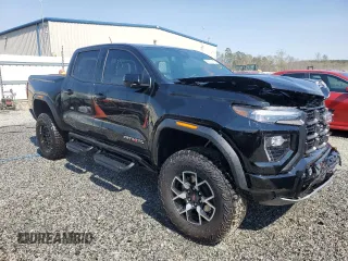 2024 GMC Canyon 4WD AT4X with VIN 1GTP6EEK7R1222174, listed as a Copart auction lot 50627415 with 2,642 mi miles and Salvage Title. Bid and sale history available at carsss.com. Image 4.