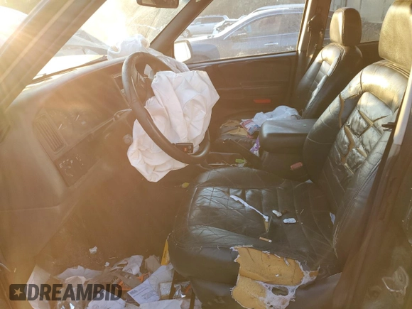 1997 Jeep Grand Cherokee TSi with VIN 1J4FX58SXVC565347, listed as a Copart auction lot 80953334 with 355,373 mi miles and Salvage Title. Bid and sale history available at carsss.com. Image 7.