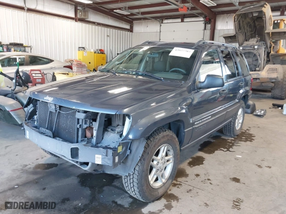 2003 Jeep Grand Cherokee Laredo with VIN 1J4GW48S33C539977, listed as a IAAI auction lot 42027703 with 100,534 mi miles. Bid and sale history available at carsss.com. Image 18.