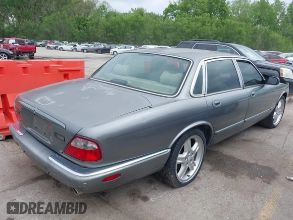 2002 Jaguar XJ with VIN SAJDA12CX2LF49531, listed as a IAAI auction lot 42124743 with 120,486 mi miles. Bid and sale history available at carsss.com. Image 4.