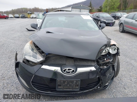 2012 Hyundai Veloster w/Gray Int z VIN KMHTC6AD6CU054422, wystawiony jako IAAI lot #41930634 z przebiegiem 144 681 mil mil oraz . Historia ofert i sprzedaży dostępna na DreamBid. Obrazek 13.