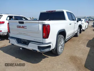 2021 GMC Sierra 1500 Denali z VIN 3GTU9FEL1MG349215, wystawiony jako IAAI lot #42585810 z przebiegiem 97 465 mil mil oraz . Historia ofert i sprzedaży dostępna na DreamBid. Obrazek 4.