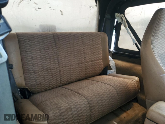 1998 Jeep Wrangler Sport with VIN 1J4FY19S5WP795781, listed as a Copart auction lot 59718065 with 208,416 mi miles and Salvage title. Bid and sale history available at DreamBid. Image 11.
