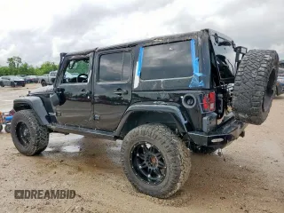 2015 Jeep Wrangler Unlimited Rubicon Hard Rock with VIN 1C4HJWFG1FL710264, listed as a Copart auction lot 54123285 with 96,737 mi miles and Salvage title. Bid and sale history available at DreamBid. Image 2.