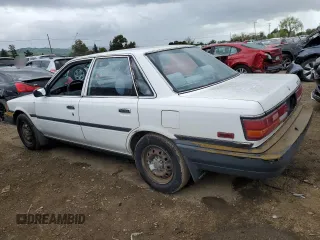 1991 Toyota Camry z VIN 4T1SV24E5MU355011, wystawiony jako Copart lot #51021185 z przebiegiem 135 881 mil mil oraz Czysty tytuł • Clean title. Historia ofert i sprzedaży dostępna na DreamBid. Obrazek 2.