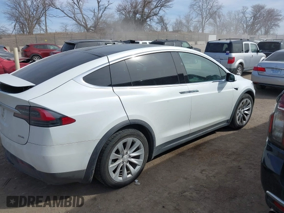 2018 Tesla Model X 75D with VIN 5YJXCBE27JF121834, listed as a IAAI auction lot 41769246 with 90,814 mi miles and . Bid and sale history available at carsss.com. Image 13.