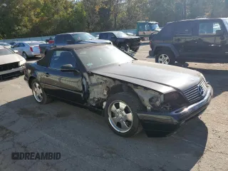 1999 Mercedes-Benz SL-Class with VIN WDBFA68F1XF184891, listed as a Copart auction lot 77082284 with 96,379 mi miles and Salvage Title. Bid and sale history available at carsss.com. Image 4.