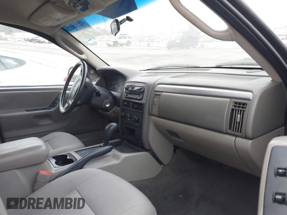 2004 Jeep Grand Cherokee Laredo with VIN 1J4GX48S34C214485, listed as a IAAI auction lot 42208120 with 164,322 mi miles and . Bid and sale history available at DreamBid. Image 5.