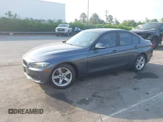 2013 BMW 3 Series 328i xDrive with VIN WBA3B3C53DJ810249, listed as a IAAI auction lot 42099473 with 125,255 mi miles. Bid and sale history available at carsss.com. Image 2.