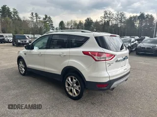 2014 Ford Escape Titanium with VIN 1FMCU9J94EUC63638, listed as a IAAI auction lot 42196241 with 198,112 mi miles and . Bid and sale history available at DreamBid. Image 3.