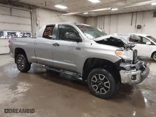 2014 Toyota Tundra 4WD Truck SR with VIN 5TFUY5F17EX357035, listed as a IAAI auction lot 39928076 with 129,831 mi miles. Bid and sale history available at carsss.com. Image 1.