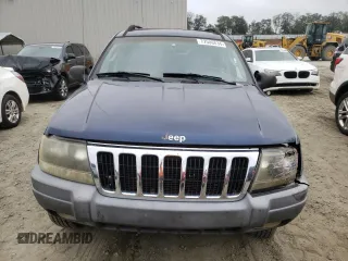 2002 Jeep Grand Cherokee z VIN 1J4GX38S42C229150, wystawiony jako Copart lot #72586834 z przebiegiem 201 103 mil mil oraz Szkoda całkowita • Salvage title. Historia ofert i sprzedaży dostępna na DreamBid. Obrazek 5.