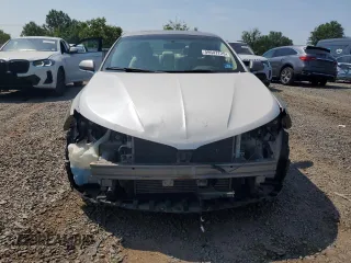 2016 Lincoln MKZ z VIN 3LN6L2J99GR620863, wystawiony jako Copart lot #59547725 z przebiegiem 121 607 mil mil oraz Szkoda całkowita • Salvage title. Historia ofert i sprzedaży dostępna na DreamBid. Obrazek 5.