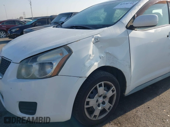 2009 Pontiac Vibe with VIN 5Y2SM67059Z401610, listed as a IAAI auction lot 42150702 with 225,835 mi miles. Bid and sale history available at carsss.com. Image 6.