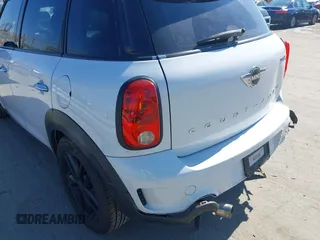 2014 MINI Countryman S with VIN WMWZC3C52EWP25060, listed as a IAAI auction lot 41642855 with 240,396 mi miles and . Bid and sale history available at DreamBid. Image 13.