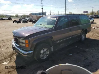 1997 GMC Suburban z VIN 3GKFK16R4VG518331, wystawiony jako Copart lot #56241425 z przebiegiem 265 201 mil mil oraz Nie do naprawy • Non repairable. Historia ofert i sprzedaży dostępna na DreamBid. Obrazek 1.