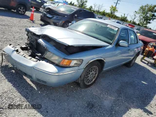 1999 Mercury Grand Marquis GS z VIN 2MEFM74W5XX711421, wystawiony jako Copart lot #53062605 z przebiegiem 106 913 mil mil oraz Nie do naprawy • Non repairable. Historia ofert i sprzedaży dostępna na DreamBid. Obrazek 1.