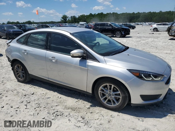 2017 Ford Focus SE with VIN 1FADP3F27HL223918, listed as a Copart auction lot 57464685 with 134,253 mi miles and Salvage title. Bid and sale history available at DreamBid. Image 4.