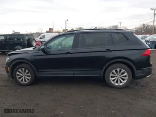 2018 Volkswagen Tiguan S with VIN 3VV1B7AX9JM091210, listed as a IAAI auction lot 41683380 with 63,627 mi miles. Bid and sale history available at carsss.com. Image 14.