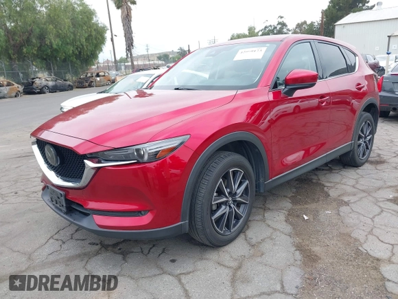 2018 Mazda CX-5 Grand Touring with VIN JM3KFADMXJ0302656, listed as a IAAI auction lot 42099173 with 125,378 mi miles and . Bid and sale history available at DreamBid. Image 2.