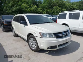 2013 Dodge Journey American Value z VIN 3C4PDCAB0DT723988, wystawiony jako IAAI lot #42263191 z przebiegiem 205 014 mil mil oraz . Historia ofert i sprzedaży dostępna na DreamBid. Obrazek 1.