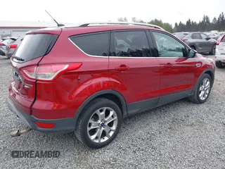 2014 Ford Escape Titanium with VIN 1FMCU9J9XEUD71715, listed as a IAAI auction lot 42127982 with 96,549 mi miles and . Bid and sale history available at DreamBid. Image 4.