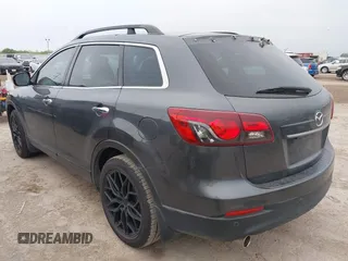 2013 Mazda CX-9 Grand Touring with VIN JM3TB2DA1D0401785, listed as a IAAI auction lot 42034331 with 128,146 mi miles and . Bid and sale history available at DreamBid. Image 3.