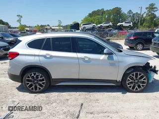2021 BMW X1 sDrive28i with VIN WBXJG7C06M5T14235, listed as a IAAI auction lot 42021762 with 53,384 mi miles and . Bid and sale history available at DreamBid. Image 13.