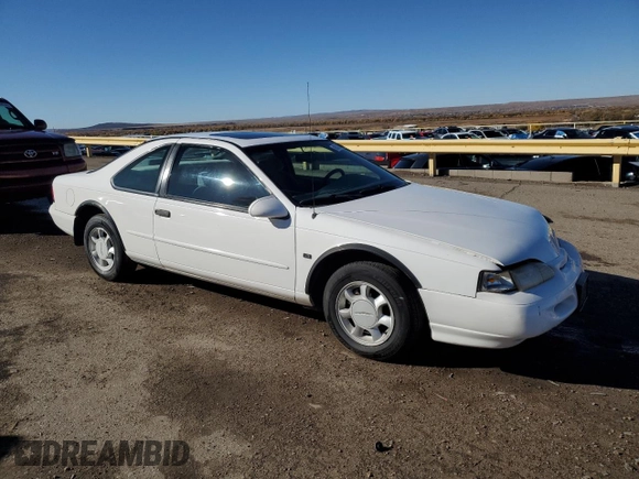 1994 Ford Thunderbird LX with VIN 1FALP62WXRH217279, listed as a Copart auction lot 80512504 with 176,798 mi miles and Salvage Title. Bid and sale history available at DreamBid. Image 4.