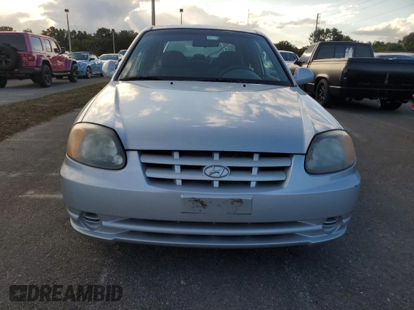 2004 Hyundai Accent GL with VIN KMHCG35C74U312579, listed as a Copart auction lot 75397884 with 0 mi miles and Salvage Title. Bid and sale history available at carsss.com. Image 5.