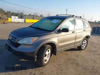 2009 Honda CR-V LX with VIN 5J6RE48389L011915, listed as a IAAI auction lot 41301796 with 214,807 mi miles. Bid and sale history available at carsss.com. Image 18.