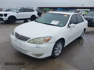 2003 Toyota Camry LE z VIN JTDBF30K530148403, wystawiony jako IAAI lot #41688346 z przebiegiem 299 143 mil mil oraz . Historia ofert i sprzedaży dostępna na DreamBid. Obrazek 20.