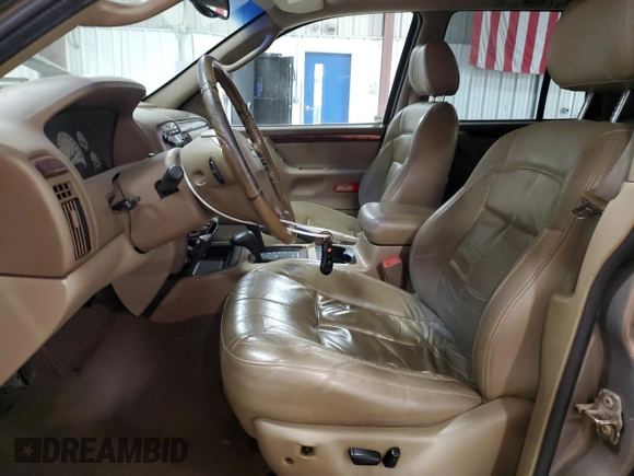 2002 Jeep Grand Cherokee Limited with VIN 1J4GW58NX2C248892, listed as a Copart auction lot 55574615 with 164,010 mi miles and Salvage title. Bid and sale history available at DreamBid. Image 7.