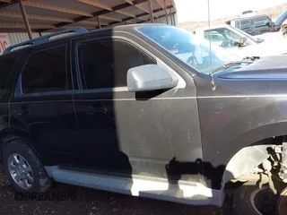 2011 Mazda Tribute Sport with VIN 4F2CY9C7XBKM06202, listed as a IAAI auction lot 41281197 with 195,443 mi miles and . Bid and sale history available at DreamBid. Image 12.