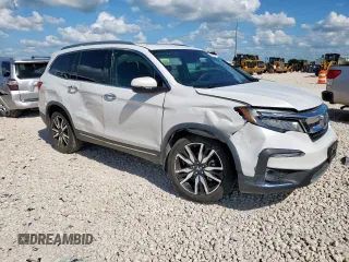 2020 Honda Pilot Touring 7-Passenger with VIN 5FNYF6H69LB018905, listed as a Copart auction lot 61209685 with 61,637 mi miles and Salvage title. Bid and sale history available at DreamBid. Image 4.