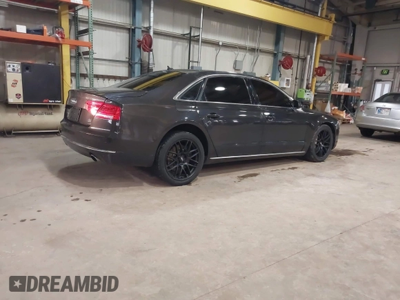 2012 Audi A8 z VIN WAURVAFD6CN014546, wystawiony jako IAAI lot #41357932 z przebiegiem 93 516 mil mil oraz . Historia ofert i sprzedaży dostępna na DreamBid. Obrazek 4.