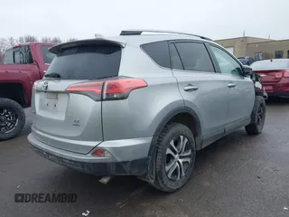 2018 Toyota RAV4 LE with VIN 2T3BFREVXJW717079, listed as a IAAI auction lot 42001580 with 96,044 mi miles. Bid and sale history available at carsss.com. Image 4.