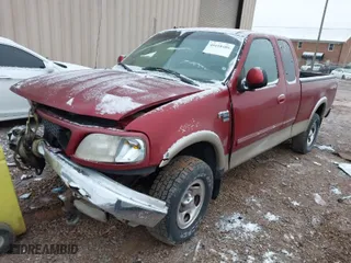 2000 Ford F-150 XL with VIN 1FTRX18L6YNA92785, listed as a IAAI auction lot 41618404 with 136,991 mi miles. Bid and sale history available at carsss.com. Image 2.